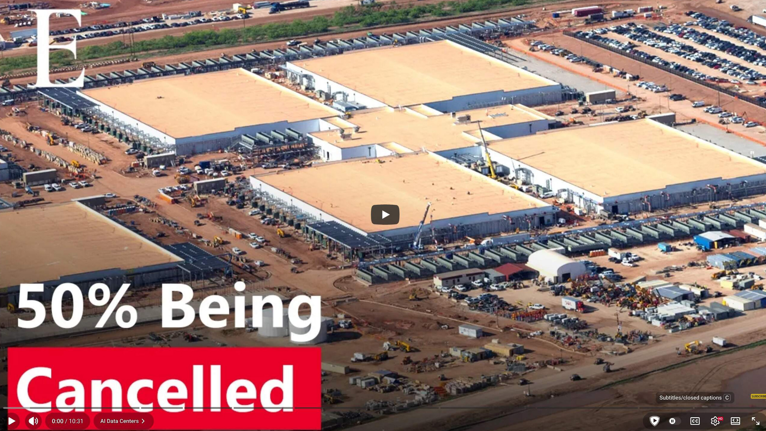 Frame from the Economy Media video: an aerial view of a data-center construction site with the caption 50% Being Cancelled